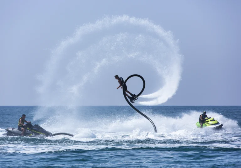 man-is-riding-wave-while-another-man-is-riding-wave